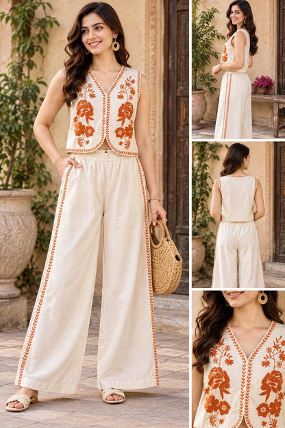May include: A sleeveless cream-coloured top with a V-neckline and orange floral embroidery paired with matching wide-leg trousers featuring orange side-stripe detailing. The set includes a cropped vest-style top and high-waisted trousers.